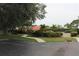 Beautiful walkway with manicured landscaping and mature trees enhance the beauty of the community at 1806 Mariner Dr # 214, Tarpon Springs, FL 34689