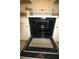 Oven with an open door and interior racks at 1806 Mariner Dr # 214, Tarpon Springs, FL 34689