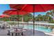 Relax on the patio while taking in views of the pool on a sunny day at 1806 Mariner Dr # 214, Tarpon Springs, FL 34689