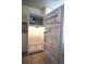 Refrigerator with an open door and a built-in ice maker at 1806 Mariner Dr # 214, Tarpon Springs, FL 34689