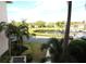 Scenic water view with lush landscaping, community boat docks, and plenty of parking at 1806 Mariner Dr # 214, Tarpon Springs, FL 34689