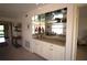 Wet bar area with light countertops, cabinets, and shelving at 1806 Mariner Dr # 214, Tarpon Springs, FL 34689