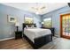 Serene bedroom with a queen bed and access to balcony at 9660 90Th Ave, Seminole, FL 33777