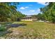 House surrounded by lush trees and landscaping at 9660 90Th Ave, Seminole, FL 33777