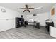 Spacious home office with built-in shelving and hardwood floors at 9660 90Th Ave, Seminole, FL 33777