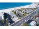 Aerial view showing building, parking, and beach access at 4510 Gulf Blvd # 508, St Pete Beach, FL 33706