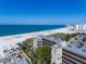 Aerial view of beachfront property with ocean, beach, and building at 4510 Gulf Blvd # 508, St Pete Beach, FL 33706