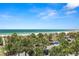View from balcony showcases beach, palm trees, and ocean at 4510 Gulf Blvd # 508, St Pete Beach, FL 33706