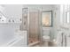 Bathroom with shower, toilet, and washer/dryer at 108 11Th Ave, St Pete Beach, FL 33706