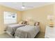 Two twin beds in a bright bedroom with yellow walls at 108 11Th Ave, St Pete Beach, FL 33706