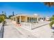 Bright yellow house with white picket fence and a spacious yard at 108 11Th Ave, St Pete Beach, FL 33706