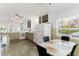 A galley-style kitchen with green cabinets and white appliances at 108 11Th Ave, St Pete Beach, FL 33706