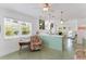 Retro-style kitchen with a breakfast bar and terrazzo flooring at 108 11Th Ave, St Pete Beach, FL 33706