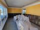 A living room undergoing renovation, showing exposed walls and flooring at 108 11Th Ave, St Pete Beach, FL 33706