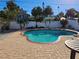 Inviting kidney-shaped pool with brick patio and small table at 108 11Th Ave, St Pete Beach, FL 33706