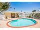 Inviting kidney-shaped pool with brick coping and patio at 108 11Th Ave, St Pete Beach, FL 33706