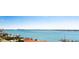 Stunning aerial view showcasing water, coastline, and nearby buildings at 1380 Gulf Blvd # 1008, Clearwater Beach, FL 33767