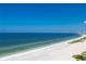 Panoramic view of expansive beach and clear water at 1380 Gulf Blvd # 1008, Clearwater Beach, FL 33767