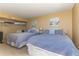 Guest bedroom with two twin beds, ample closet space, and coastal decor at 1380 Gulf Blvd # 1008, Clearwater Beach, FL 33767