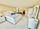 Spacious main bedroom with a king bed and ensuite bathroom at 1380 Gulf Blvd # 1008, Clearwater Beach, FL 33767