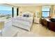 Bright bedroom with a king-size bed and water views at 1380 Gulf Blvd # 1008, Clearwater Beach, FL 33767