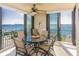 Outdoor patio with table and chairs, offering water views at 1380 Gulf Blvd # 1008, Clearwater Beach, FL 33767