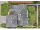 Overhead view of house with gray roof and green lawn at 3822 Salida Delsol Dr, Sun City Center, FL 33573