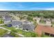 Aerial view of house and neighborhood, showcasing landscape at 3822 Salida Delsol Dr, Sun City Center, FL 33573