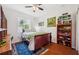 Bright bedroom with wood flooring and built-in shelving at 3822 Salida Delsol Dr, Sun City Center, FL 33573