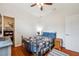 Comfortable bedroom with wood floors and closet at 3822 Salida Delsol Dr, Sun City Center, FL 33573