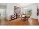 Bright dining room with wood table and large quilt at 3822 Salida Delsol Dr, Sun City Center, FL 33573