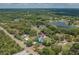 Wide aerial view showing home location and nearby lake at 7414 Van Dyke Rd, Odessa, FL 33556