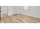 Bright bedroom with white walls and light wood floors at 7414 Van Dyke Rd, Odessa, FL 33556