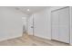 Bedroom with light hardwood floors, white walls and a closet at 7414 Van Dyke Rd, Odessa, FL 33556