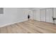 Spacious bedroom with light wood floors and white walls at 7414 Van Dyke Rd, Odessa, FL 33556