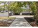 Long driveway leading to the house and detached garage at 7414 Van Dyke Rd, Odessa, FL 33556
