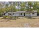 Newly remodeled home with a modern facade and landscaping at 7414 Van Dyke Rd, Odessa, FL 33556