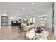 Open concept living room with a view of the kitchen at 7414 Van Dyke Rd, Odessa, FL 33556