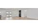 Bright living room with French doors leading to backyard at 7414 Van Dyke Rd, Odessa, FL 33556