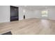 Bright living room with modern fireplace and light wood floors at 7414 Van Dyke Rd, Odessa, FL 33556