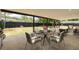 Covered patio with seating area, perfect for outdoor dining at 7414 Van Dyke Rd, Odessa, FL 33556