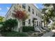 Charming white brick building with lush landscaping and pink flowers at 423 21St N Ave, St Petersburg, FL 33704