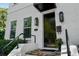 Modern white brick home with black door and stylish light fixtures at 423 21St N Ave, St Petersburg, FL 33704