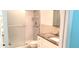 Bathroom featuring a glass shower door, granite countertops, and a sink at 2436 Rhodesian Dr # 42, Clearwater, FL 33763