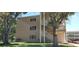 Multi-story building with exterior stairs and walkway access at 2436 Rhodesian Dr # 42, Clearwater, FL 33763