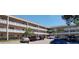 Multi-story apartment building with a parking lot at 2436 Rhodesian Dr # 42, Clearwater, FL 33763