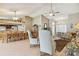 Open dining area with a wooden table and chairs, adjacent to the kitchen at 18602 Bent Pine Dr, Hudson, FL 34667