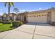 Attractive single-story home with two-car garage and landscaped front yard at 18602 Bent Pine Dr, Hudson, FL 34667