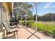 Relaxing screened porch with patio furniture and view at 18602 Bent Pine Dr, Hudson, FL 34667