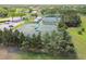 Community tennis courts with surrounding trees and landscaping at 18602 Bent Pine Dr, Hudson, FL 34667